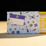 Mom Grass Stash Pack Coming Out From A Chanukah Gift Wrapping Paper