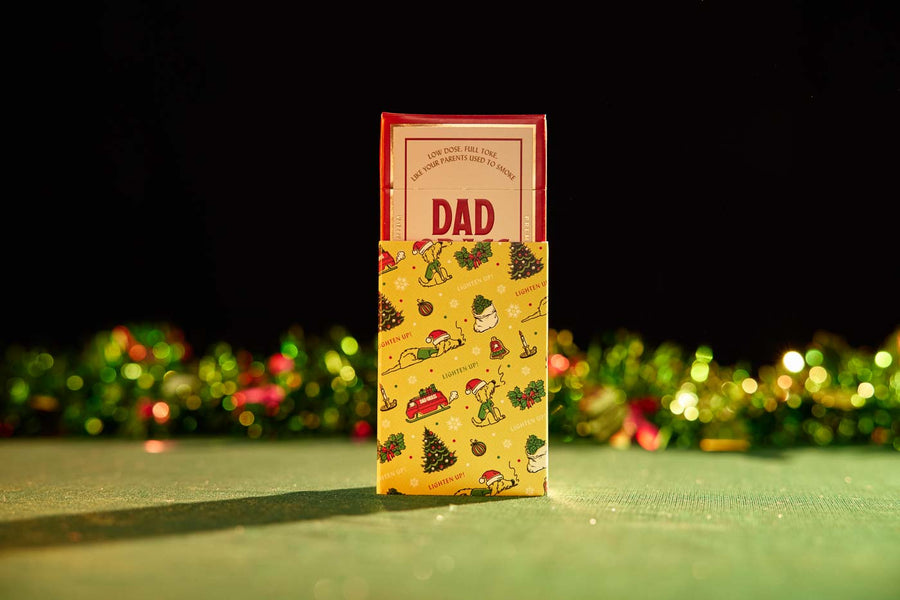Dad Grass 5 Pack CBD Joints Coming Out From Christmas Wrapping Paper