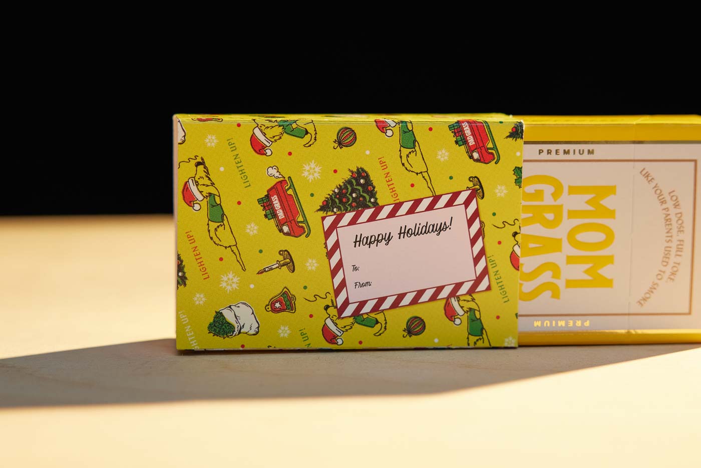 Mom Grass 5 Pack CBG Joints Coming Out From Christmas Wrapping Paper