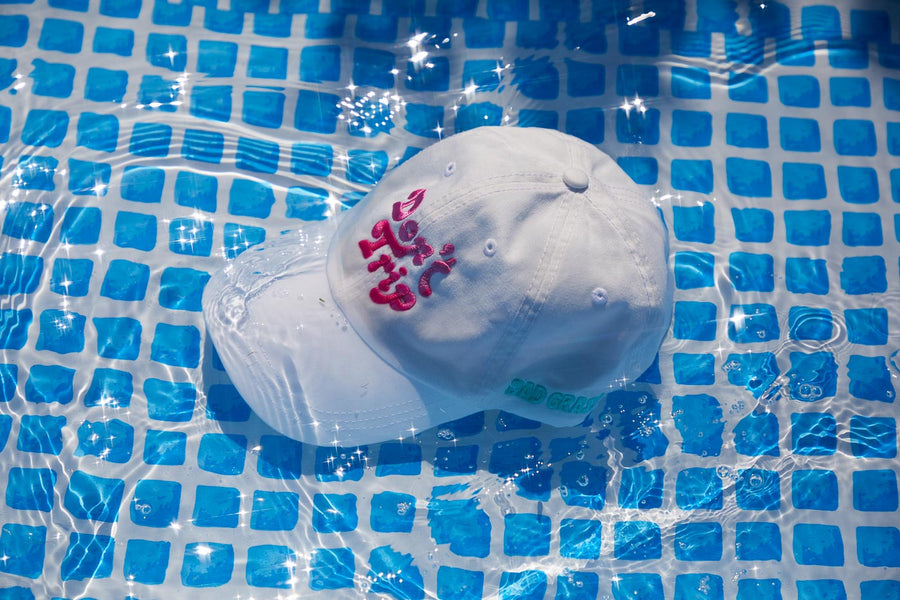 Dad Grass x Free & Easy Summer 2021 White Unisex Don't trip hat in pool side view