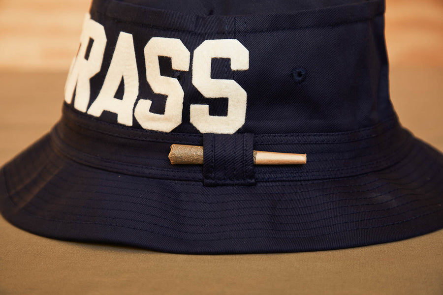 Black Bucket Hat With Dad Grass Written On It And CBD Pre roll On The Side From Side View