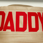 Dad Grass Pride 2021 tan bucket hat, close up view of front word "Daddy"