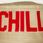 Dad Grass Pride 2021 tan bucket hat, close up view of rear word "Chill"