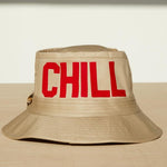 Dad Grass Pride 2021 'DADDY CHILL' tan bucket hat. Rear view says 'CHILL'.