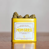 CBG Hemp Flower Coming Out From A Yellow Tin