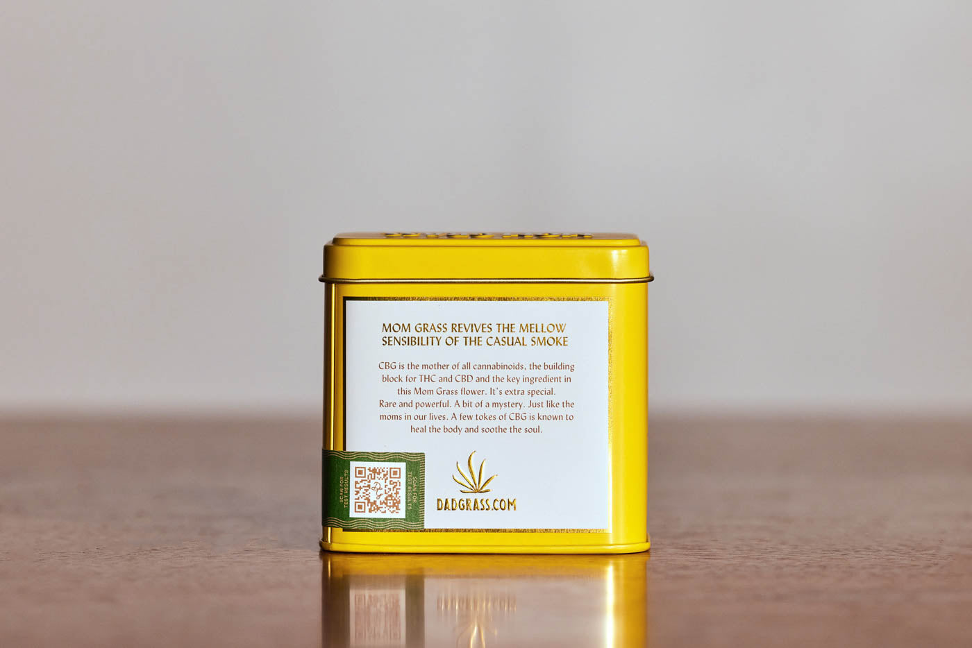 Mom Grass CBG Hemp Flower In A Yellow Tin Back View