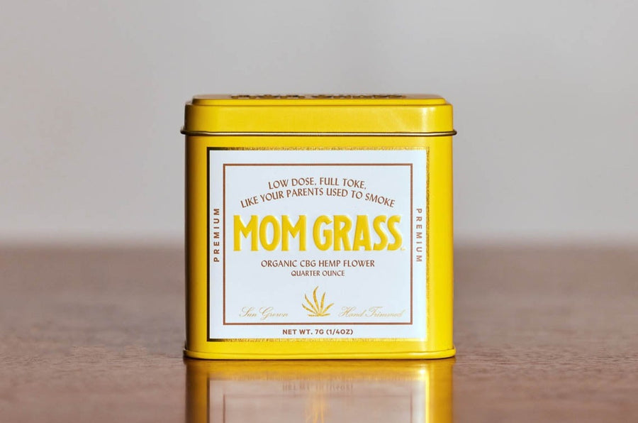 Mom Grass CBG Hemp Flower Quater Ounce In A Yellow Tin