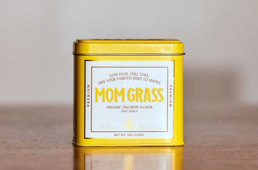 Mom Grass CBG Hemp Flower Half Ounce In A Yellow Tin