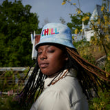A Woman wearing "Daddy Chill" Bucket Hat