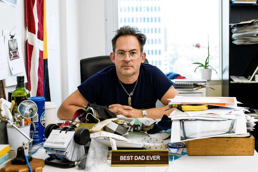 Mark McNairy Sitting On His Office With Best Dad Ever Name Plate