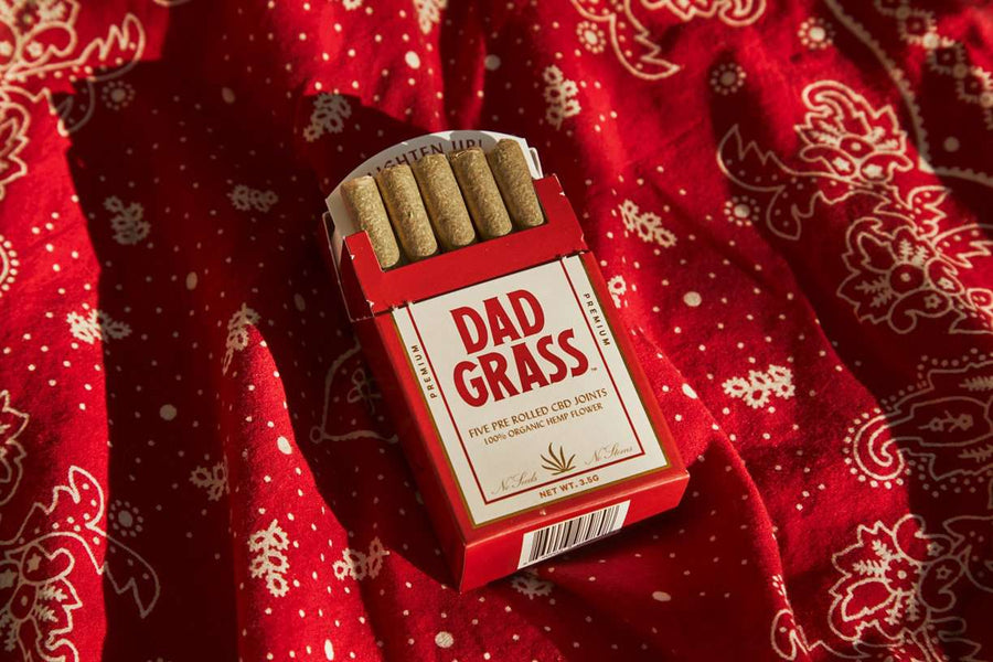 Dad Grass Hemp CBD Pre Roll Joints 5 Pack On A Red Sheet