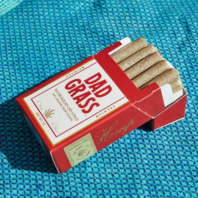 Dad Grass Hemp CBD Pre Roll 10 Pack on a blue sheet