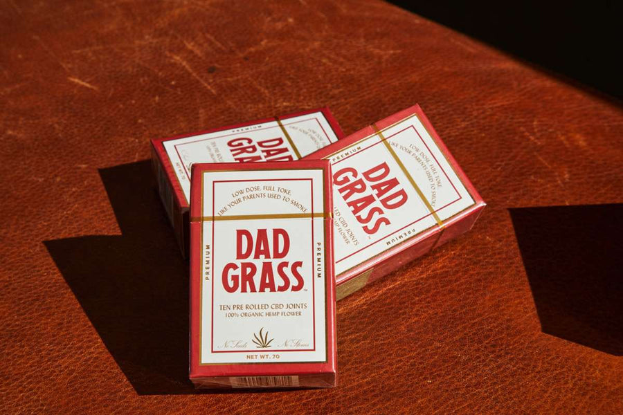 Dad Grass Hemp CBD Pre Roll 10 Pack On A Leather Couch
