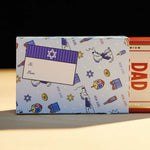 Dad Grass CBD Pre Roll Joints Pack Coming Out From A Chanukah Gift Wrapping Paper 