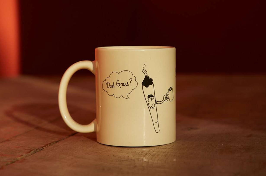Dad Grass x Yes Plz Coffee mug; a CBD preroll is holding up a joint and saying "Dad Grass?"