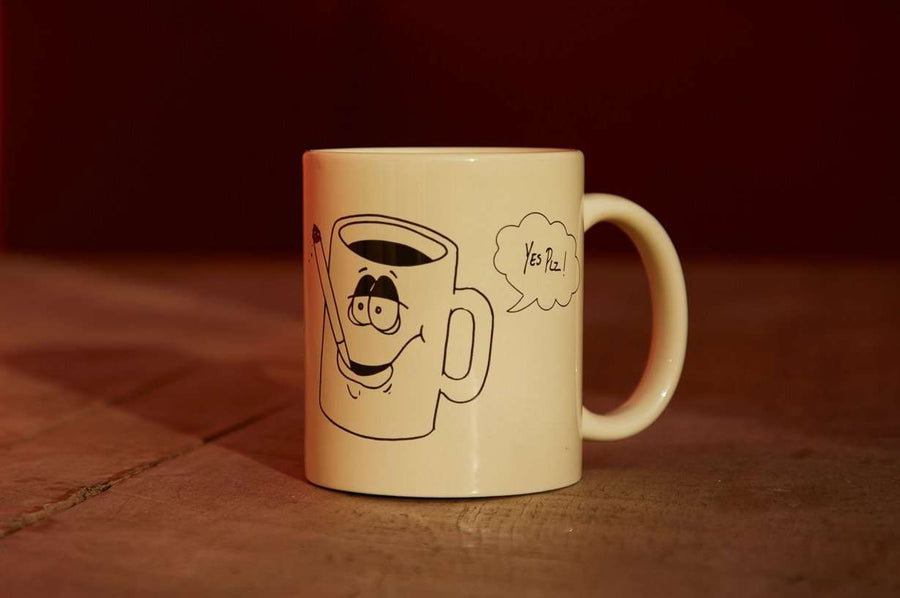 Coffee mug from Dad Grass x Yes Plz; a coffee mug is smoking a joint and saying "Yes Plz"