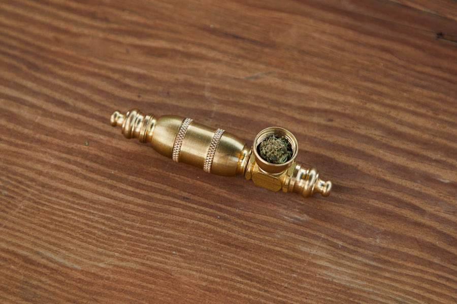 Dad Grass brass steamroller vintage smoking pipe with hemp CBD flower top view