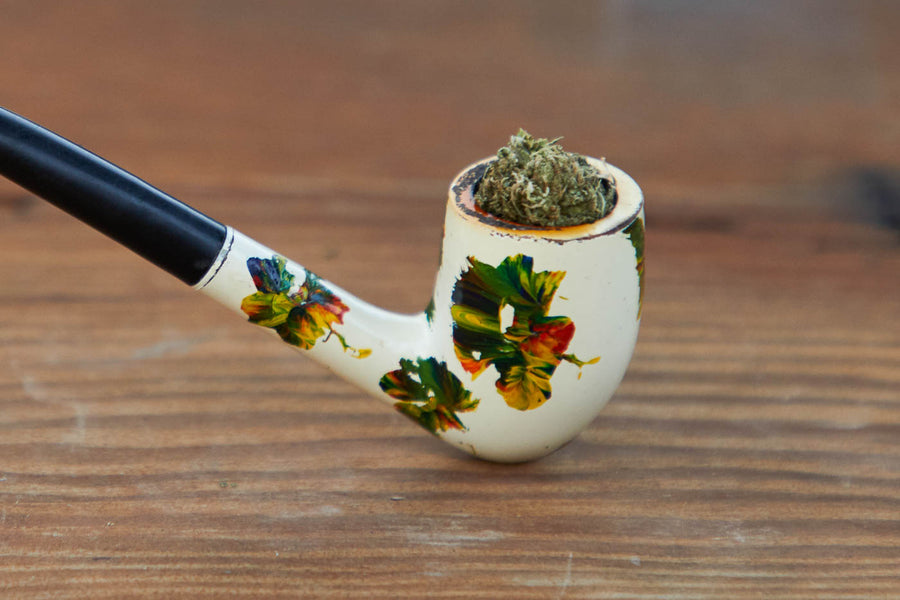 Dad Grass painted half bent billiard vintage smoking pipe with hemp CBD flower close view