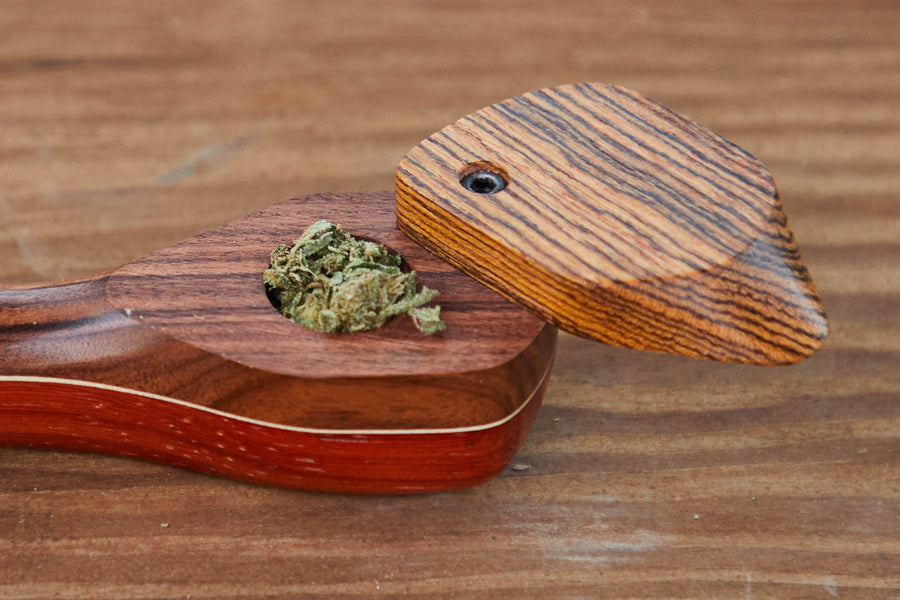 Dad Grass wood vintage smoking pipe with swivel lid and hemp CBD flower close view