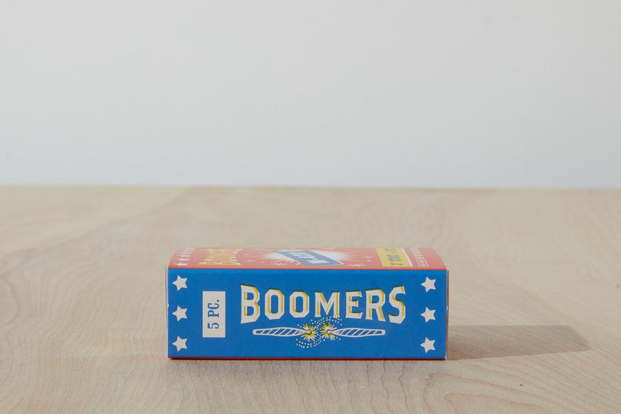Dad Grass 5 pack hemp CBD pre rolls in Boomers firework pack side view with "BOOMERS" written on it