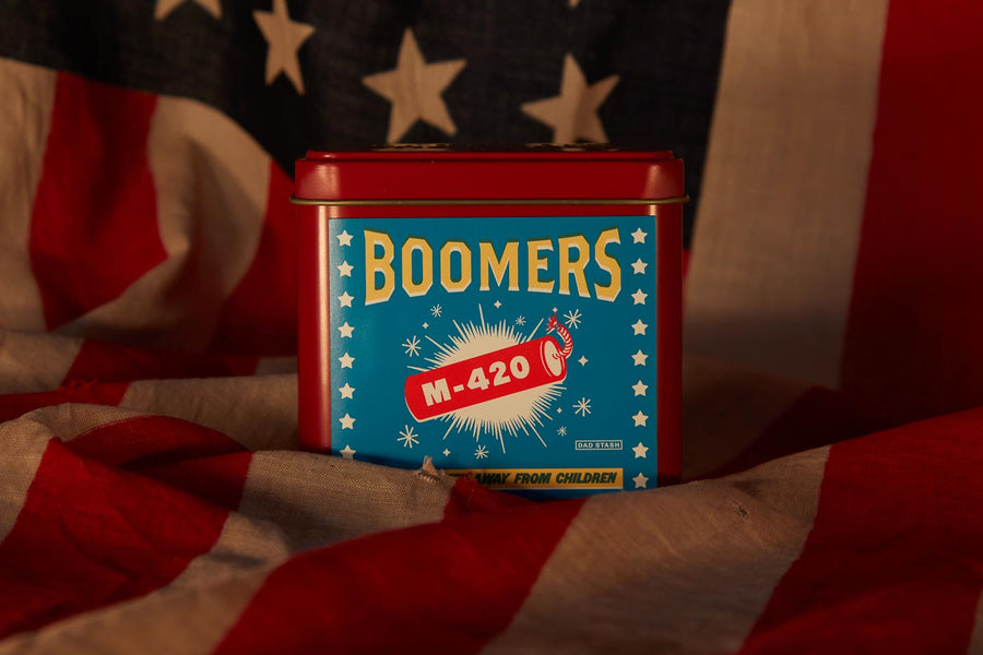 Dad Grass CBD hemp flower in Boomers firework tin can on American flag