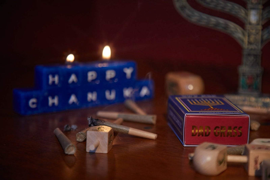 Smoking CBD Pre Roll Joints With Dad Stash Chanukah Pack, Chanukah Candles, And Lighten Up Happy Chanukah Sign
