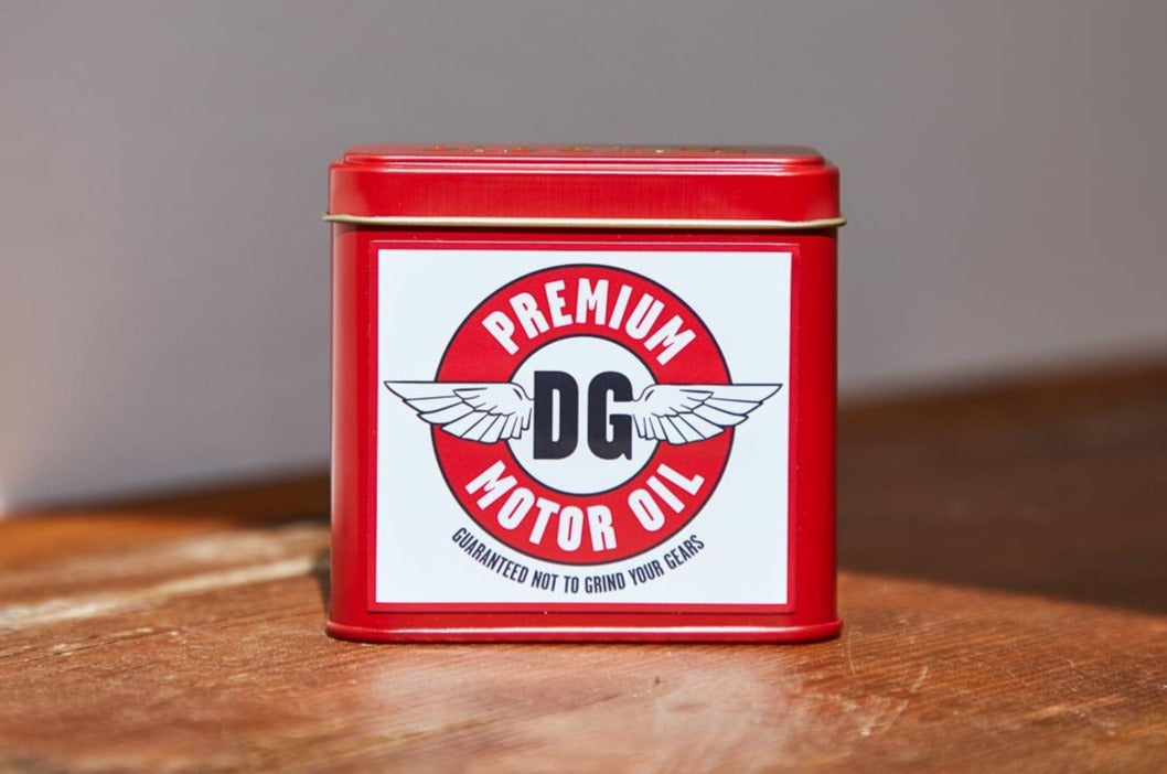 Dad Grass CBD Hemp Flower In A Red Tin With Motor Oil Stash Pack Close Up