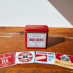 Dad Grass CBD Hemp Flower In A Red Tin With Different Hiding Stash Packs