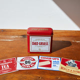Dad Grass CBD Hemp Flower In A Red Tin With Different Hiding Stash Packs