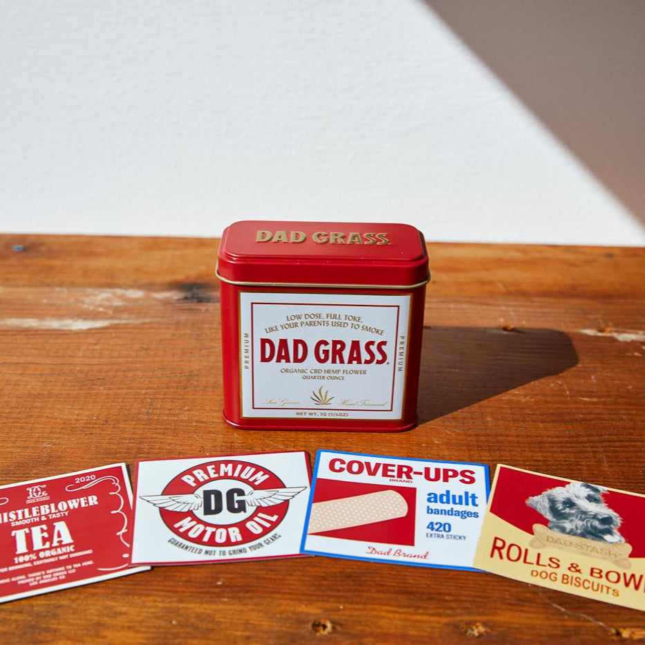 Dad Grass CBD Hemp Flower In A Red Tin With Different Hiding Stash Packs