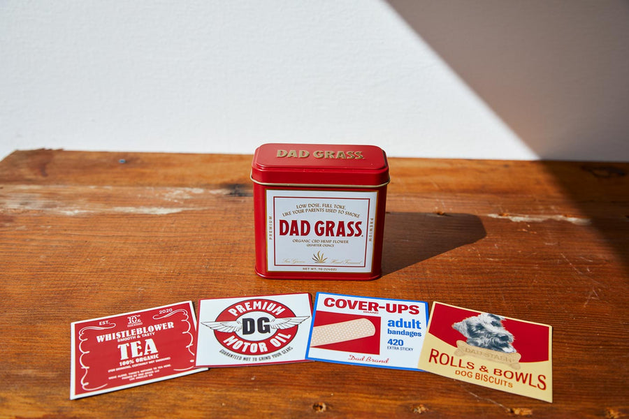 Dad Grass CBD Hemp Flower In A Red Tin With Different Hiding Stash Packs