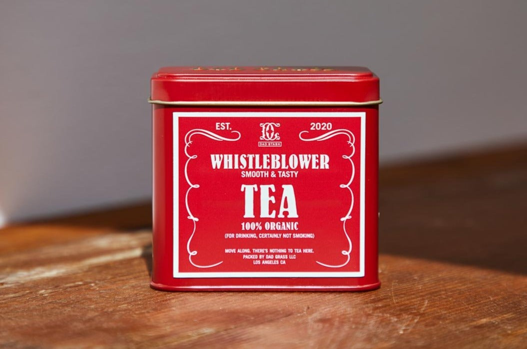Dad Grass CBD Hemp Flower In A Red Tin With Whistleblower Stash Packs Close Up
