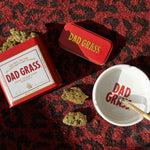 Dad Grass CBD Hemp Flower And CBD Joints On Red & Black Carpet