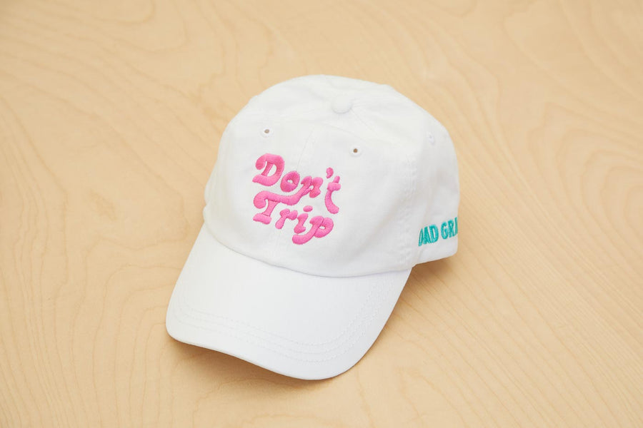 Dad Grass x Free & Easy Summer 2021 White Unisex Don't trip hat on wooden table