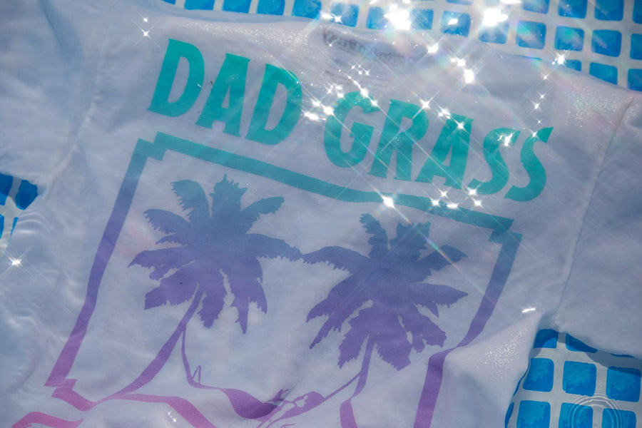 Dad Grass x Free & Easy Summer 2021 White Unisex Tee Shirt back view in the pool