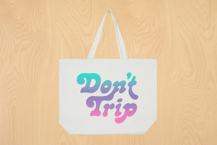 Dad Grass x Free & Easy Summer 2021 white unisex don't trip pool tote bag on wooden table