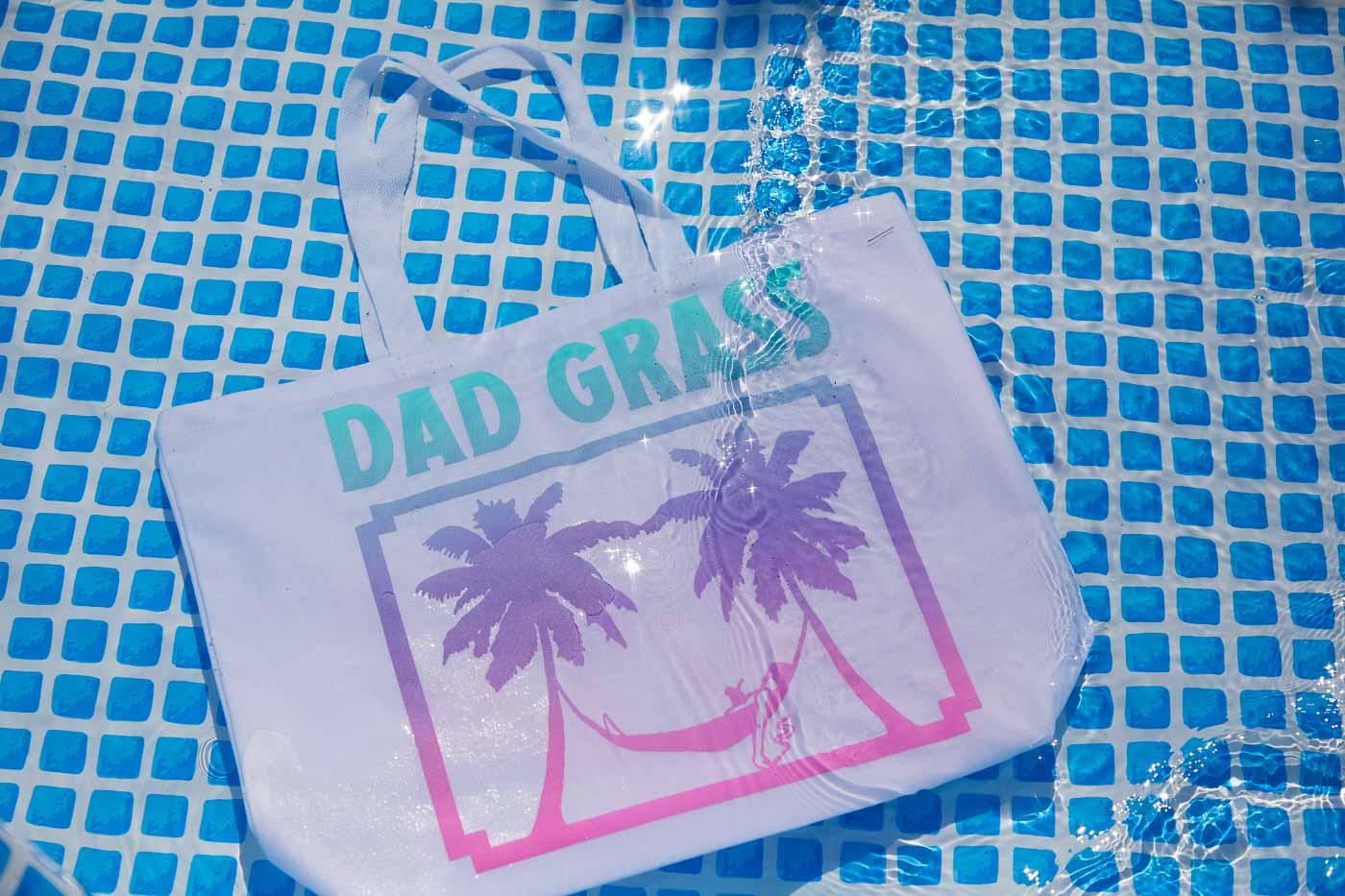 Dad Grass x Free & Easy Summer 2021 white unisex pool tote bag in pool