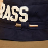 Black Bucket Hat With Dad Grass Written On It And CBD Pre roll On The Side From Side View