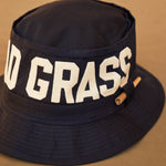 Black Bucket Hat With Dad Grass Written On It And CBD Pre roll On The Side Close Up