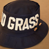 Black Bucket Hat With Dad Grass Written On It And CBD Pre roll On The Side Close Up