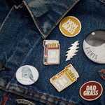 Dad Grass Pack Pin with other Pins on denim jacket