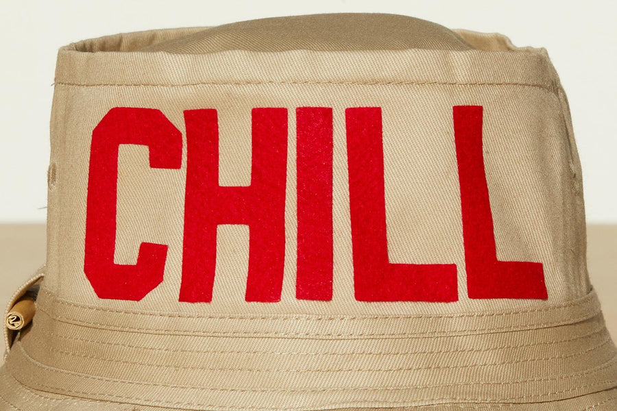 Dad Grass Pride 2021 tan bucket hat, close up view of rear word "Chill"