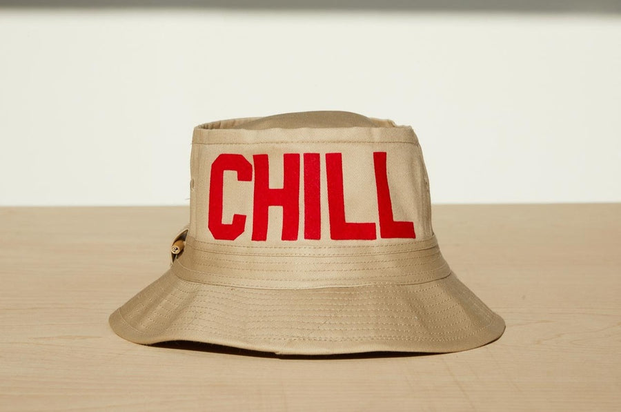 Dad Grass Pride 2021 'DADDY CHILL' tan bucket hat. Rear view says 'CHILL'.