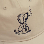 Dad Grass Cream White Dad Hat With Rollie Dog Smoking On It Close Up