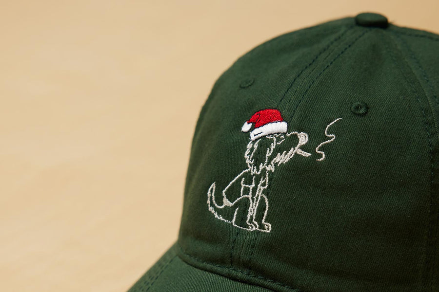 Santa Rollie Smoking CBD Pre Roll Joint Logo On A Dad Grass Dark Green Dad Hat