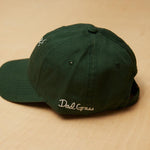 Dad Grass Written On A Dark Green Dad Hat