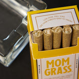 10 CBG Hemp Pre rolls in a Yellow Mom Grass pack with a glass ashtray