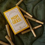 Pre rolls with 10 CBG Hemp Pre rolls in a Yellow Mom Grass pack on a sheet