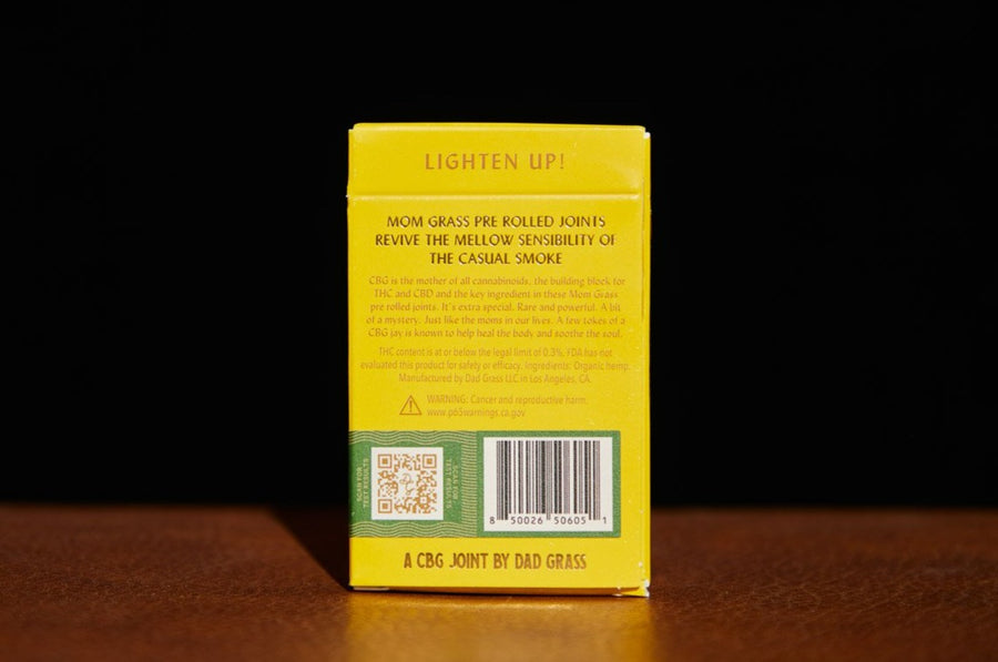 Mom Grass CBG hemp joint 5 pack, back view showing product description: "Lighten up! Mom Grass pre rolled joints revive the mellow sensibility of the casual smoke."