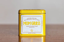 Mom Grass CBG Hemp Flower Quater Ounce In A Yellow Tin